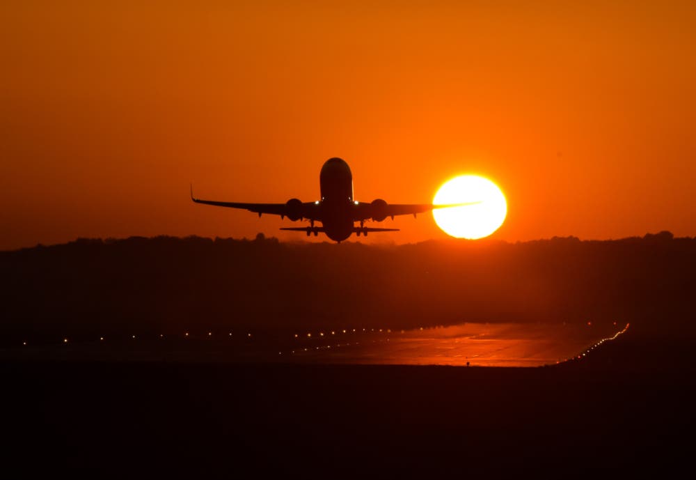 A plane seen taking off during sunset at Krakow's Balice