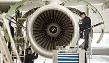 Chinese labourers work at the distribution chain for jet engines as French Prime Minister Manuel Valls visits an Airbus factory in Tianjin
