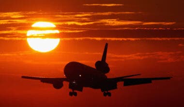 Plane with sun at sunset
